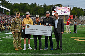 MG (R) Robert Mixon, GEN (R) Walter "Skip" Sharp, and COL (R) John Martin, presented a 50th Reunion Gift